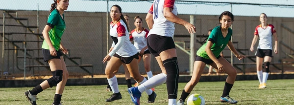 women playing football