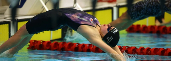 Swimmer Holly McGill dives into the pool.