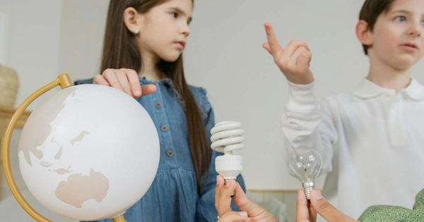 boy and girl with globe