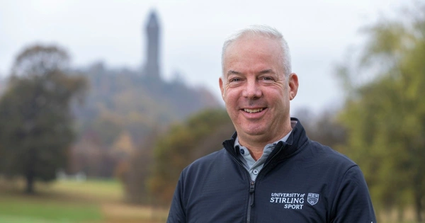 Dean Robertson head shot, in front of Wallace Monument.