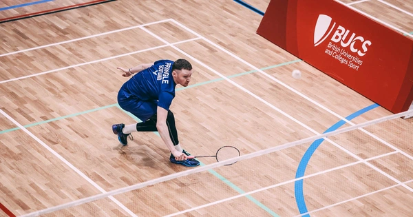 student athlete playing badminton