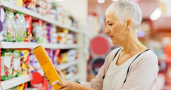 Woman looking at food packaging