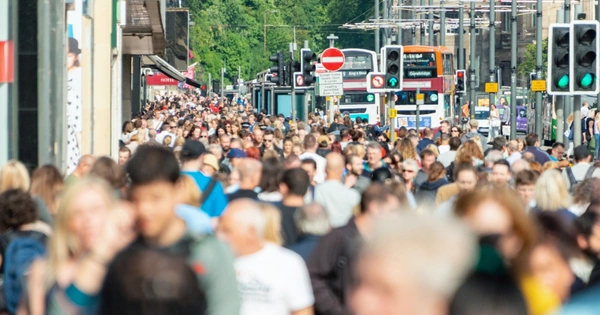 Crowd of people shopping in street