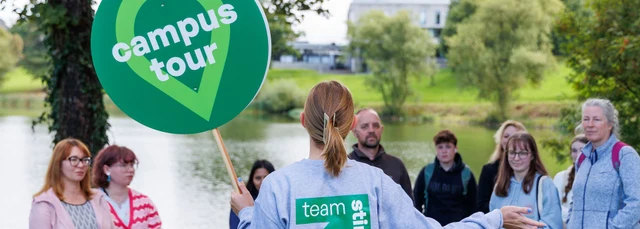 A student ambassador leading a campus tour