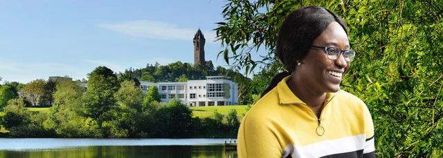 Student in front of University landscape