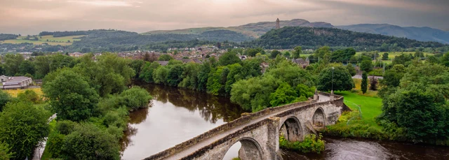 Drone shot of Stirling Old Bridge, Forth Valley and Wallace Monument