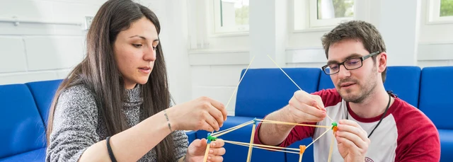 Lab assistants conducting a tower experiment