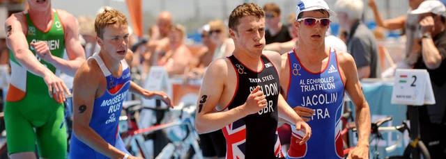 Men racing in international triathlon race