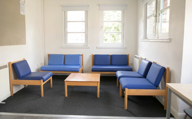 alexander court standard seating area with blue chairs
