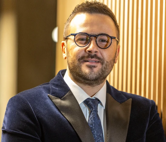 man with glasses and tie