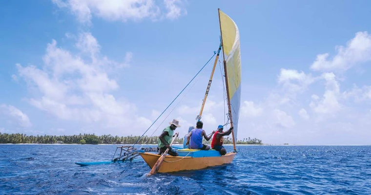 men on sailing boat