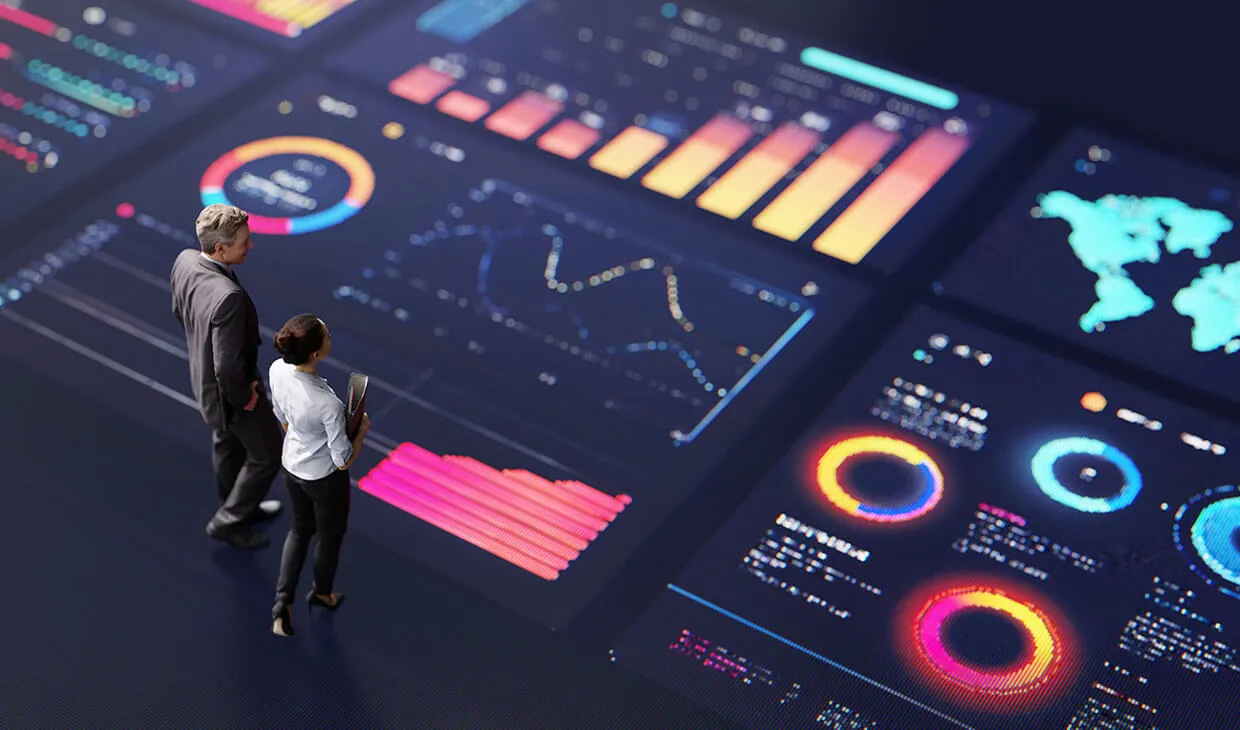 Abstract people standing on a large digital screen, analysing interactive data visualisations and charts for strategic planning.