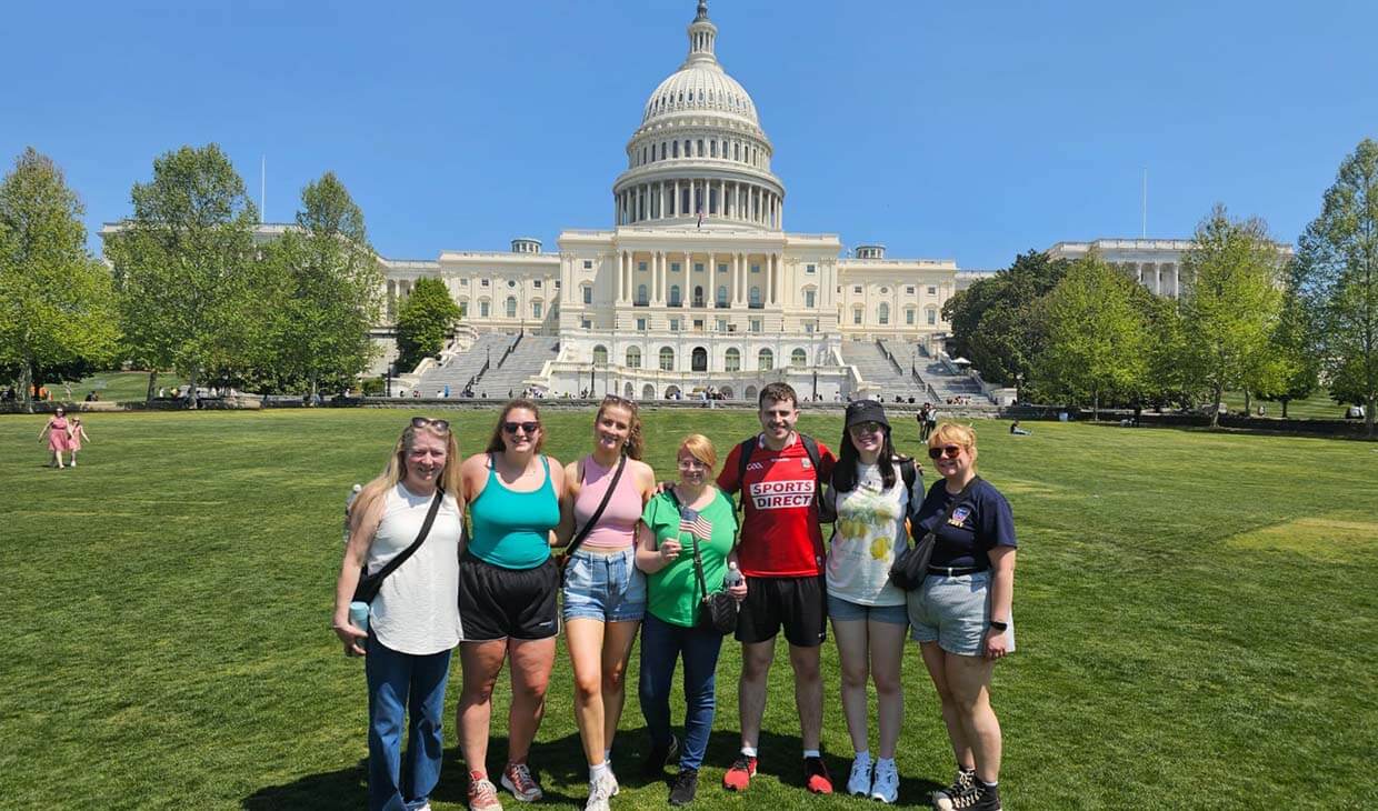 Gourp of nurses pose in front of Capital Building, Washington, USA