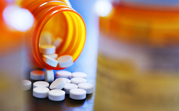 open bottle with pills